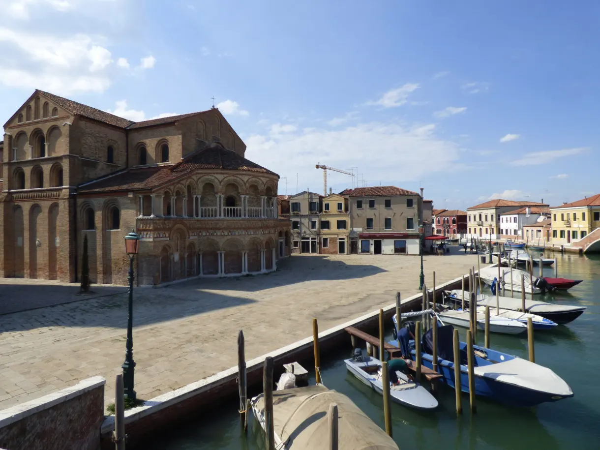 Brick church on an open square at the water's edge