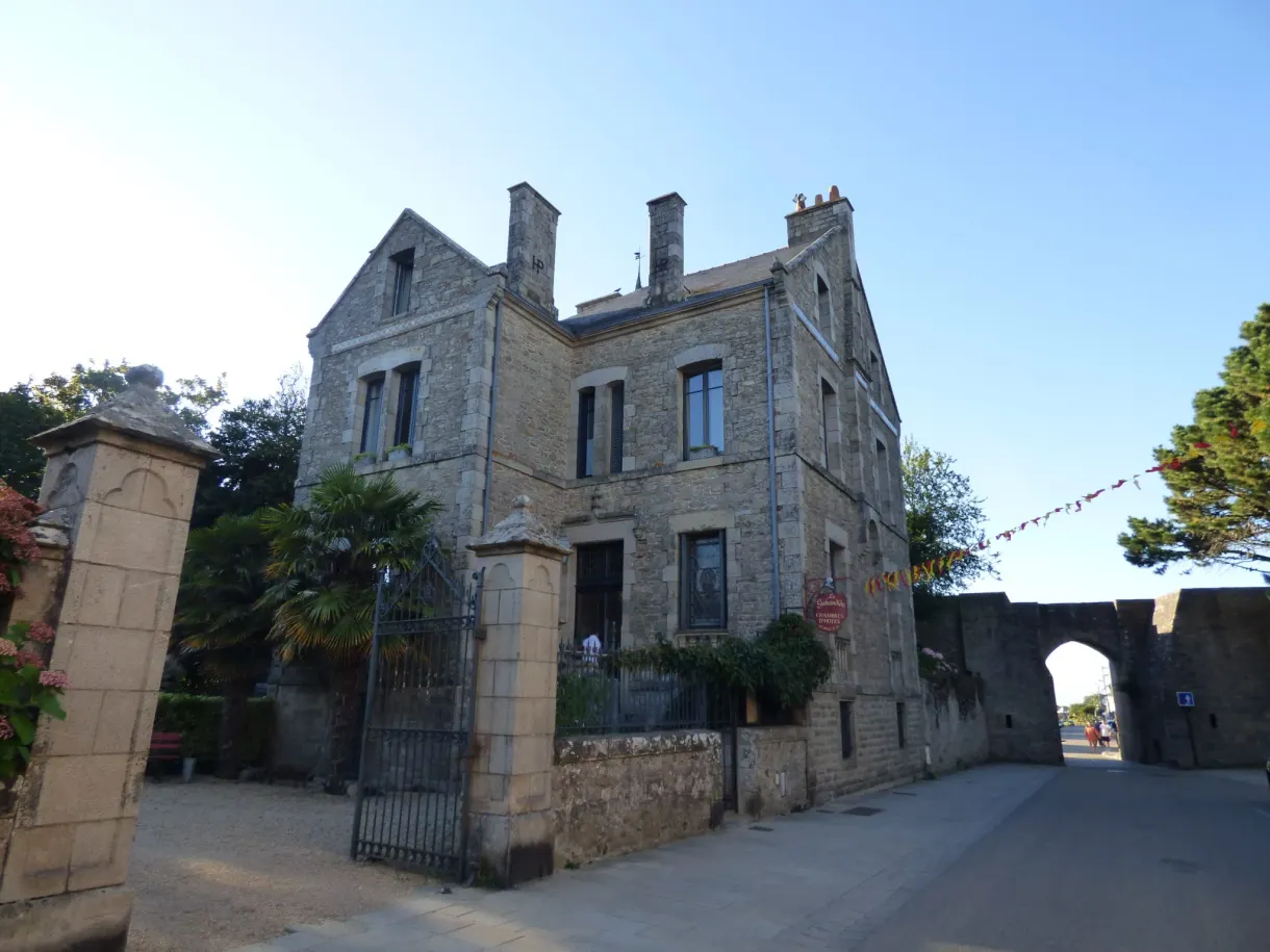 Granite building and rampart gate at the end of the street
